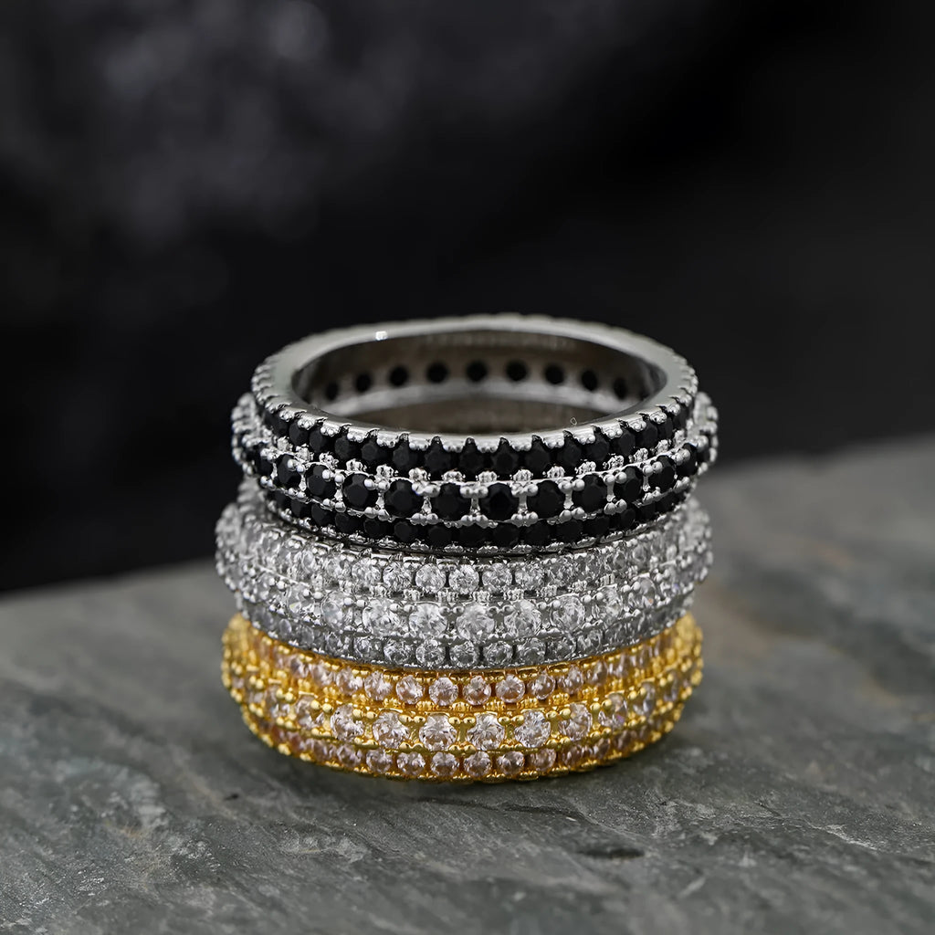 Geometric triangular unisex ring with a central zircon stone, shown in white gold, yellow gold, and white and black plating options.