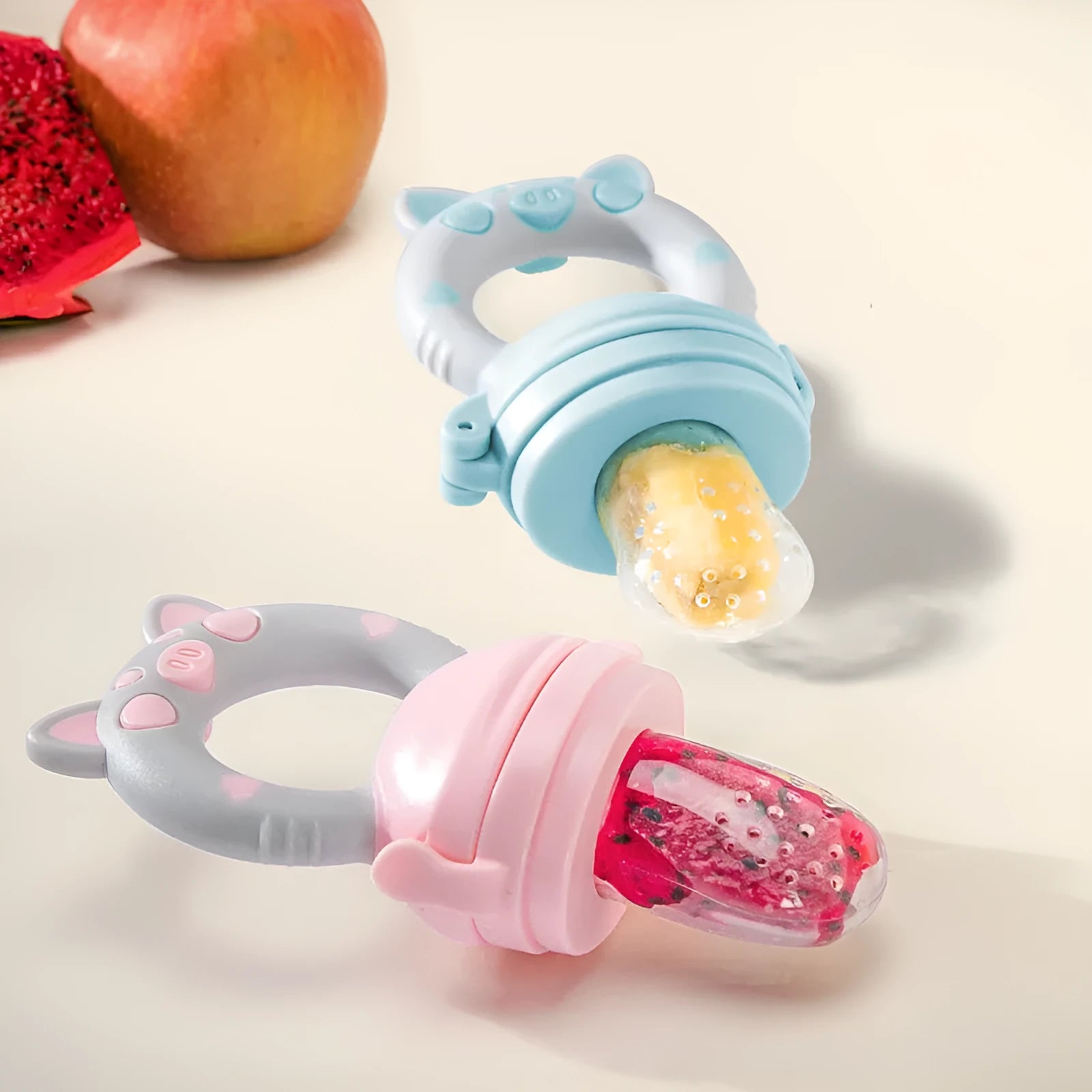Silicone baby teether chew toy in blue, green, or pink colours with textured mouthpiece design