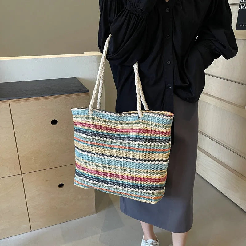 Blue straw woven single-shoulder bag with nylon construction and polyester lining.