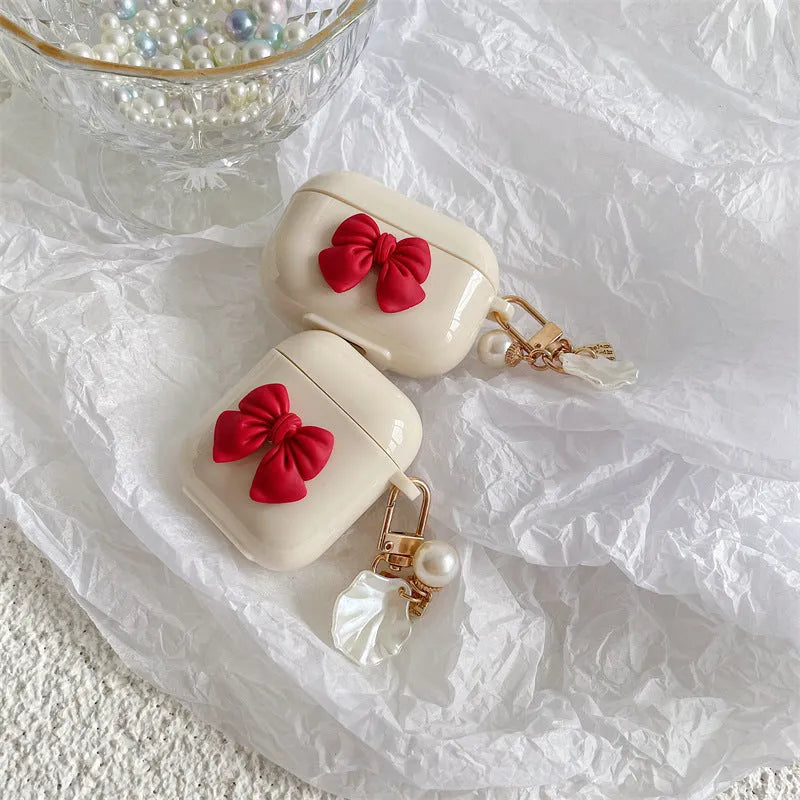 Beige red bow shell TPU AirPods case cover with clamshell design for AirPods 3, Pro 3, and 1/2 models