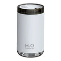 White jellyfish-themed USB humidifier with warm night light on a wooden table.