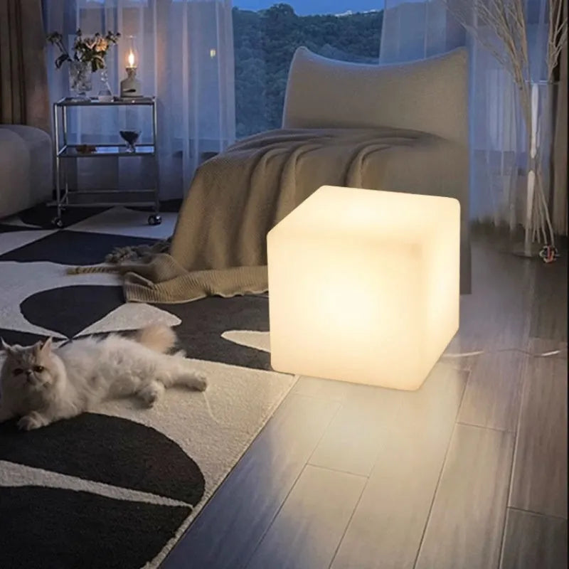 Modern square white LED cube stool light for garden patio with solar panel on top.