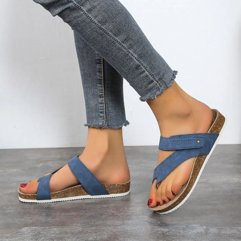 Thick-soled foam flip-flops with a flat toe ring in blue, shown on a white background.