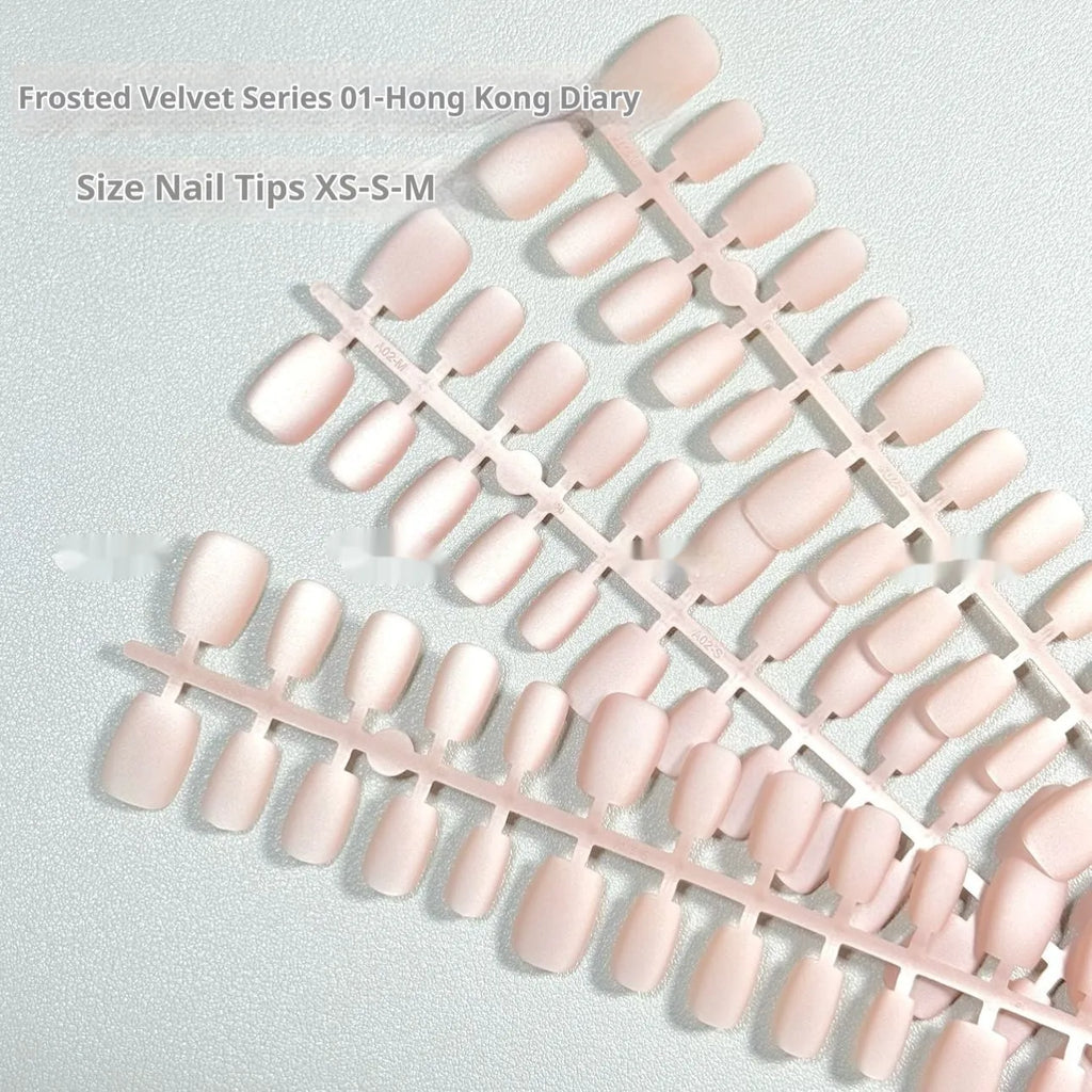 Set of frosted velvet Cat's Eye false nails with aurora armour shine in short ladder XS, S, and M sizes.