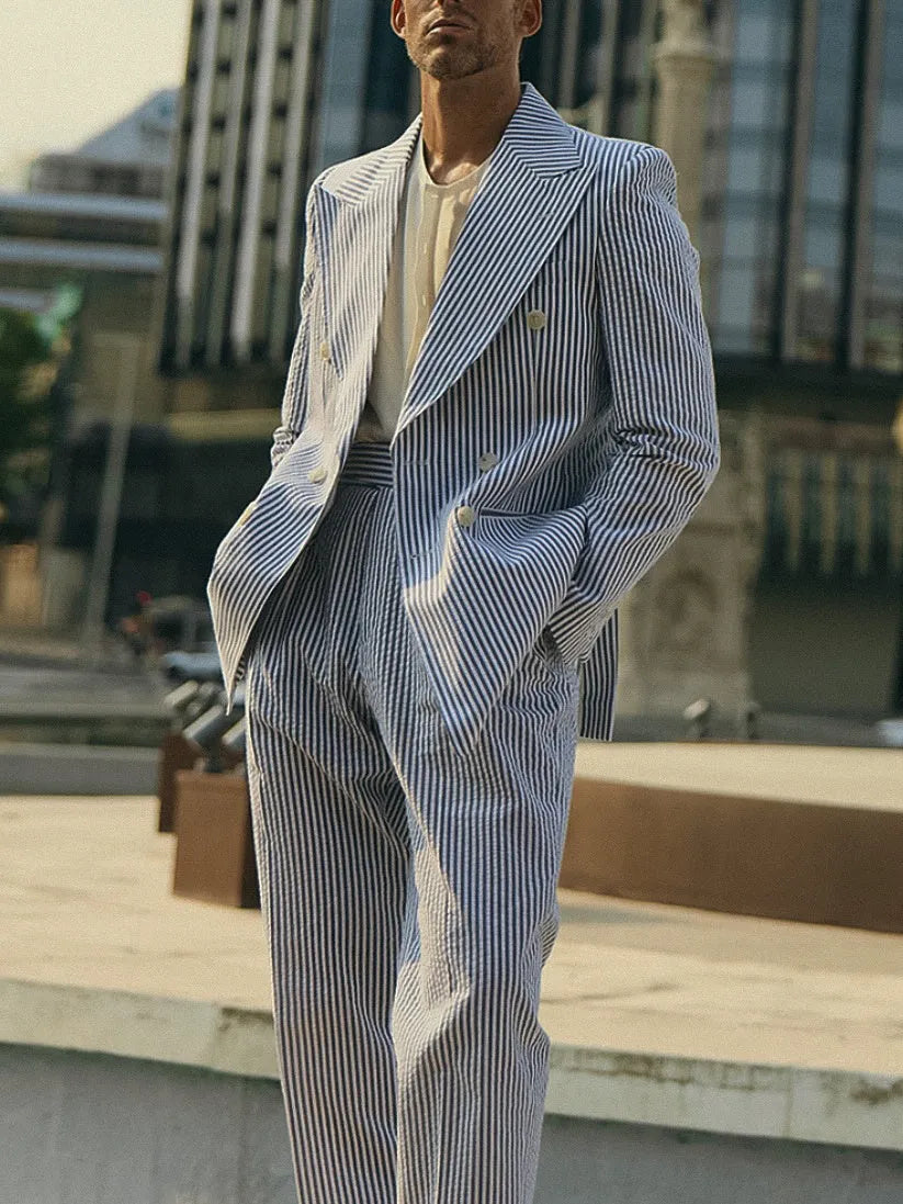 Blue and white striped men's suit set with polyester blazer and trousers on hanger