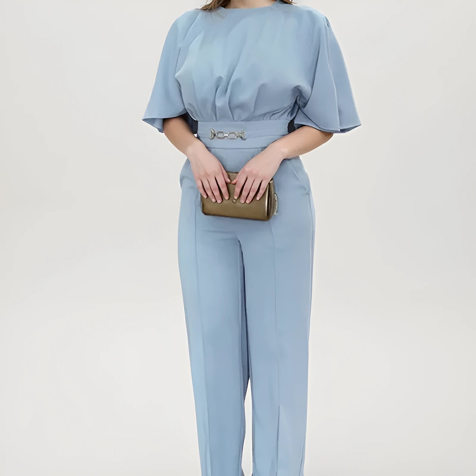 Blue men's polyester suit with trousers and long-sleeved shirt on hanger