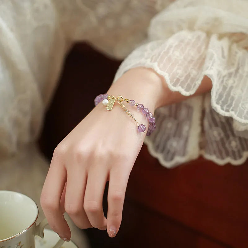 Women's lavender amethyst crystal bracelet with animal zodiac design in dark and light colour options