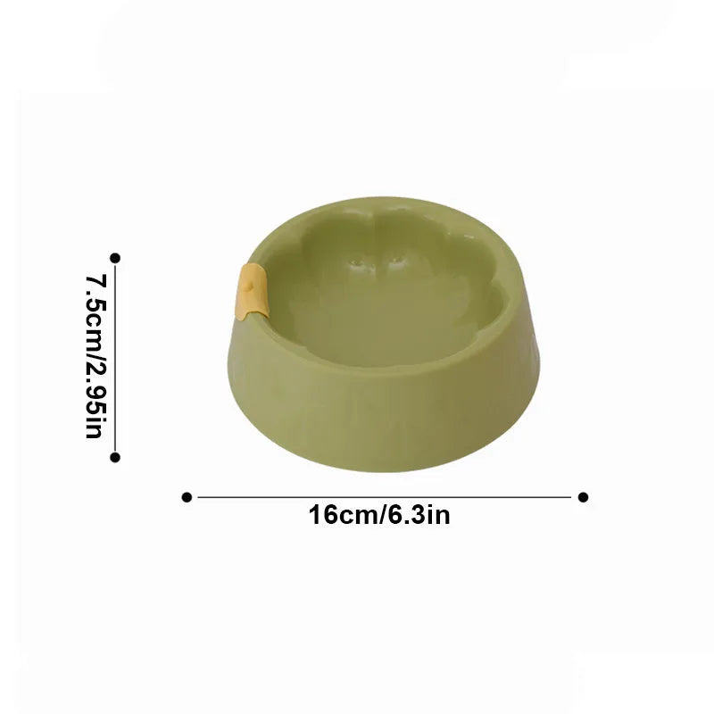 Green plastic anti-tipping pet bowl for dog and cat food and water.