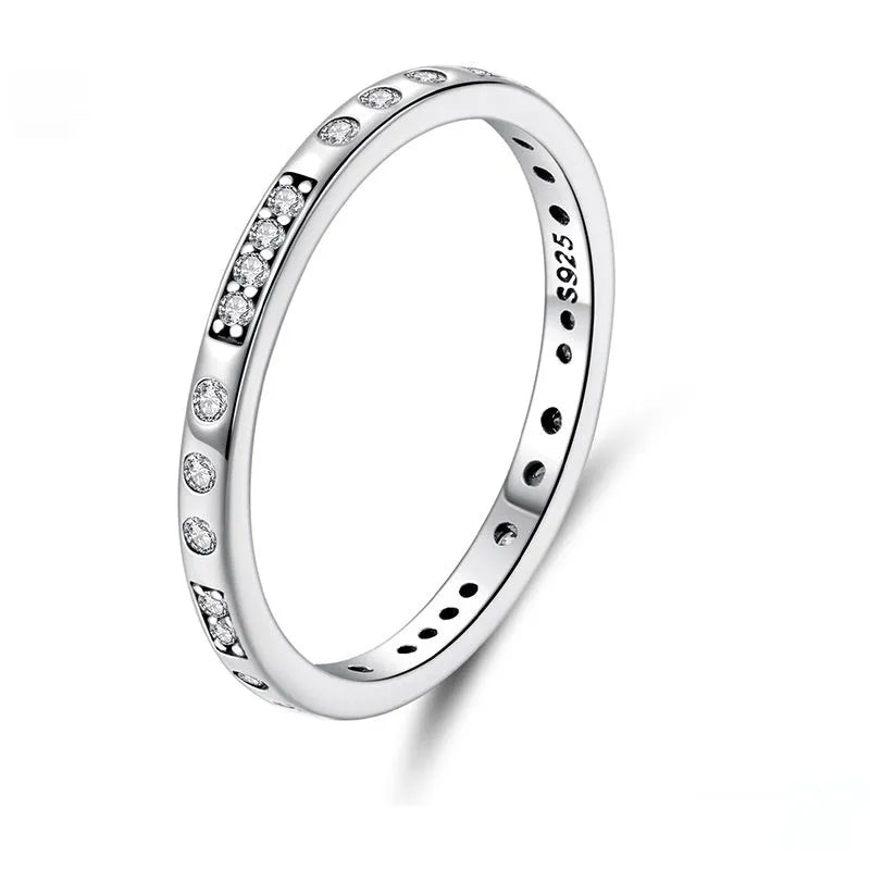 Simple silver Moss Password I Love You ring with oxidised black finish, shown on a model's finger.