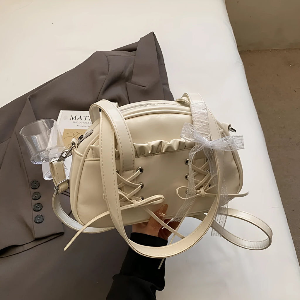 Women's PU bandage bow handbag in milky white with shoulder strap and sewing thread detailing