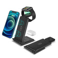 Black and white 3-in-1 wireless charging station for phone, AirPods and Apple Watch on a desk.
