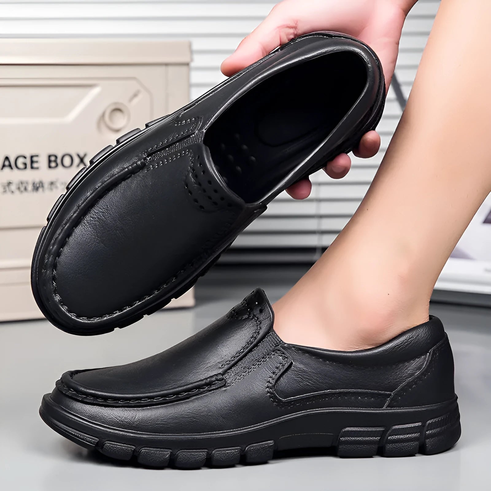 Men's black leather slip-on shoe with a mid-top design and platform sole