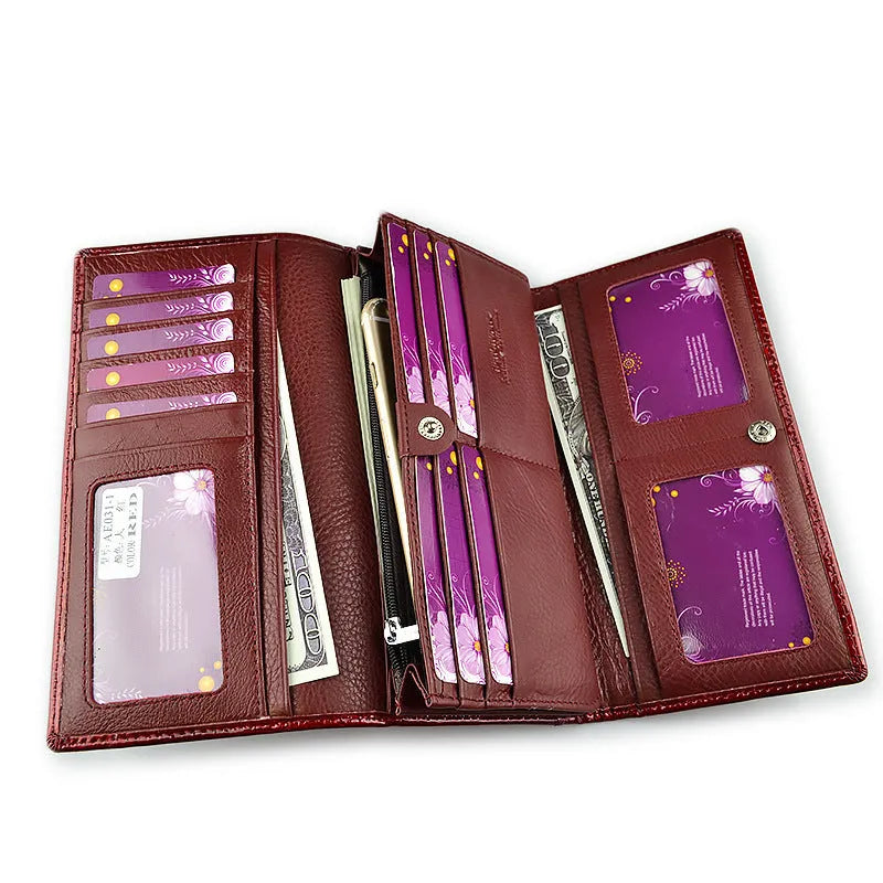 Women's patent leather coin purse with crocodile pattern in wine red colour showing pigskin lining