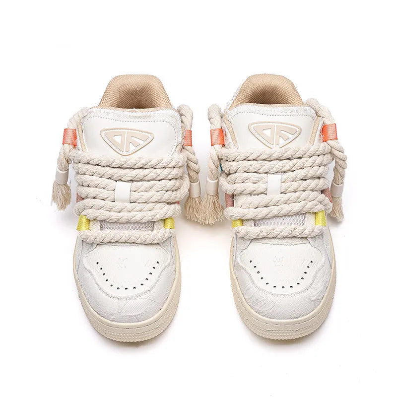 Creamy white retro low-top skate shoes with old damage lace and a platform sole