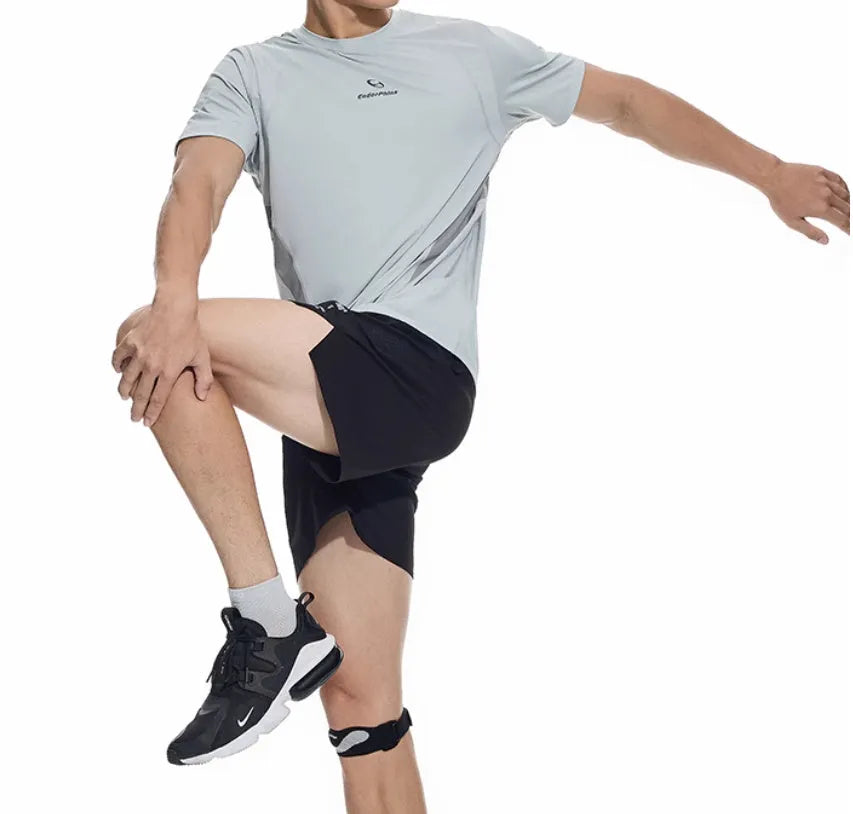 Black and blue four-point running shorts with laser stitching on stretch fabric.