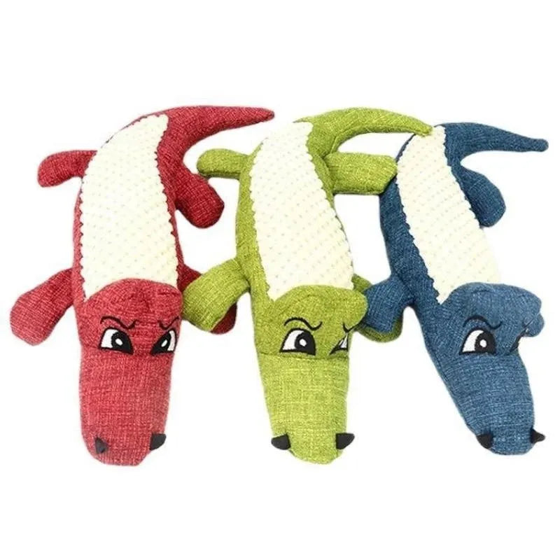 Plush corn-shaped pet toy with squeaker in blue, green, or red for chewing and grinding.