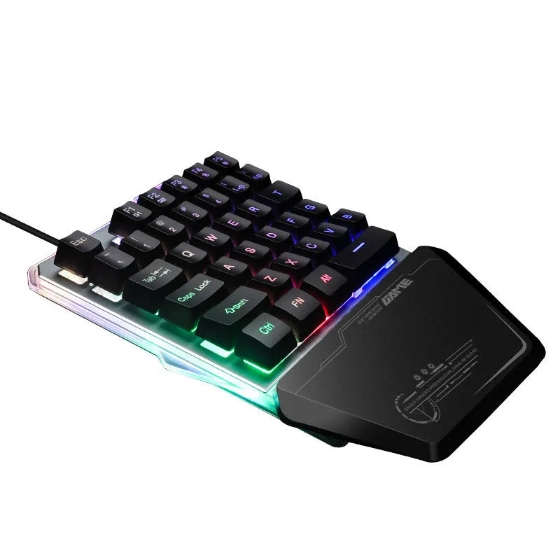 Black G40 one-handed mechanical keyboard with RGB backlighting on a desk.