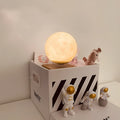 Maglev floating planet night light in a choice of colours with LED glow and USB cable.
