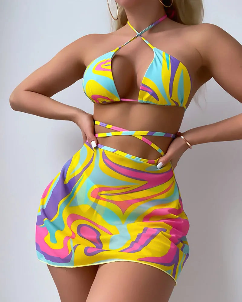 Yellow striped women's halter swimsuit with lace-up front, shown with matching high-waisted skirt and shorts.