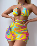 Yellow striped women's halter swimsuit with lace-up front, shown with matching high-waisted skirt and shorts.