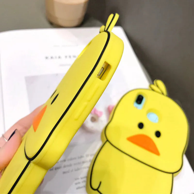 Green and yellow silicone iPhone cases with cartoon animal designs for waterproof, drop-resistant protection.