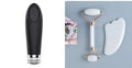 White jade facial roller and matching massage board set on a flat surface.