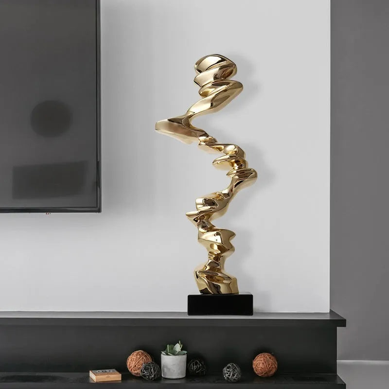 Minimalist abstract still life ornament made from natural resin in a choice of gold, silver, or blue finish.