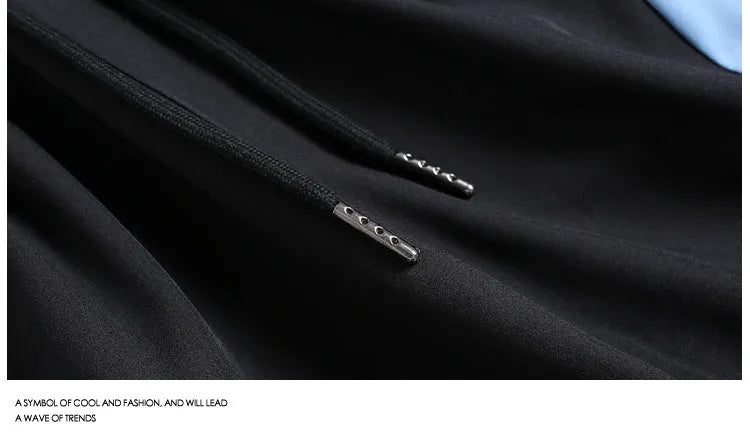 Men's black loose-fit quick-drying sports shorts with elastic waistband on a grey background