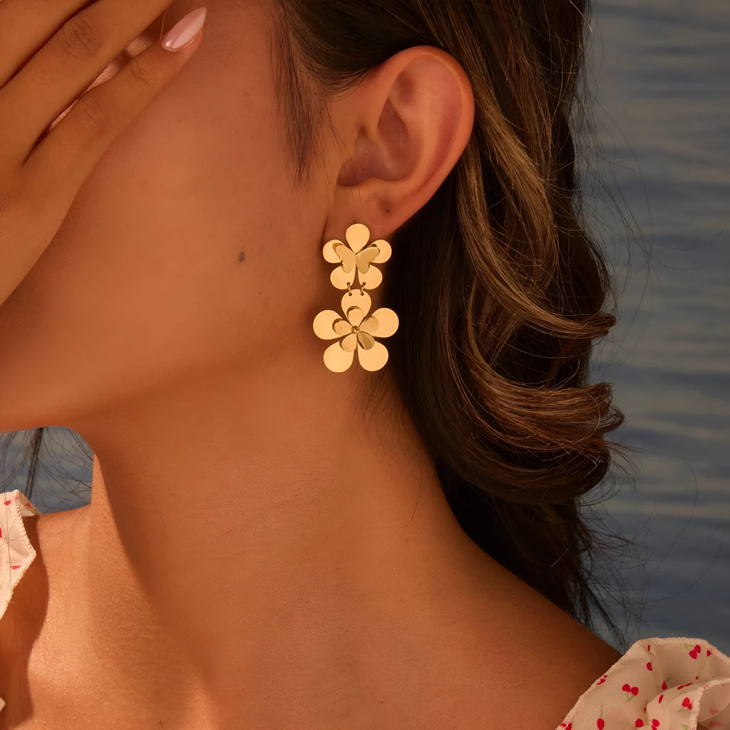 Gold flower butterfly stainless steel earrings with geometric and zodiac design elements