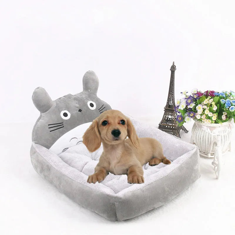Blue cartoon-style soft plush pet bed sofa for a small dog, with raised sides.