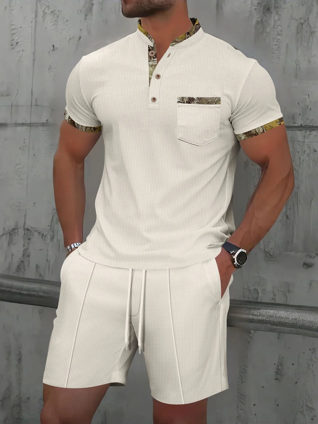 Man wearing grey waffle texture short sleeve polo with zip front and matching shorts