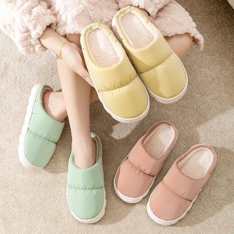 Down cotton slippers with artificial leather upper, rubber sole and plush lining in multiple colours