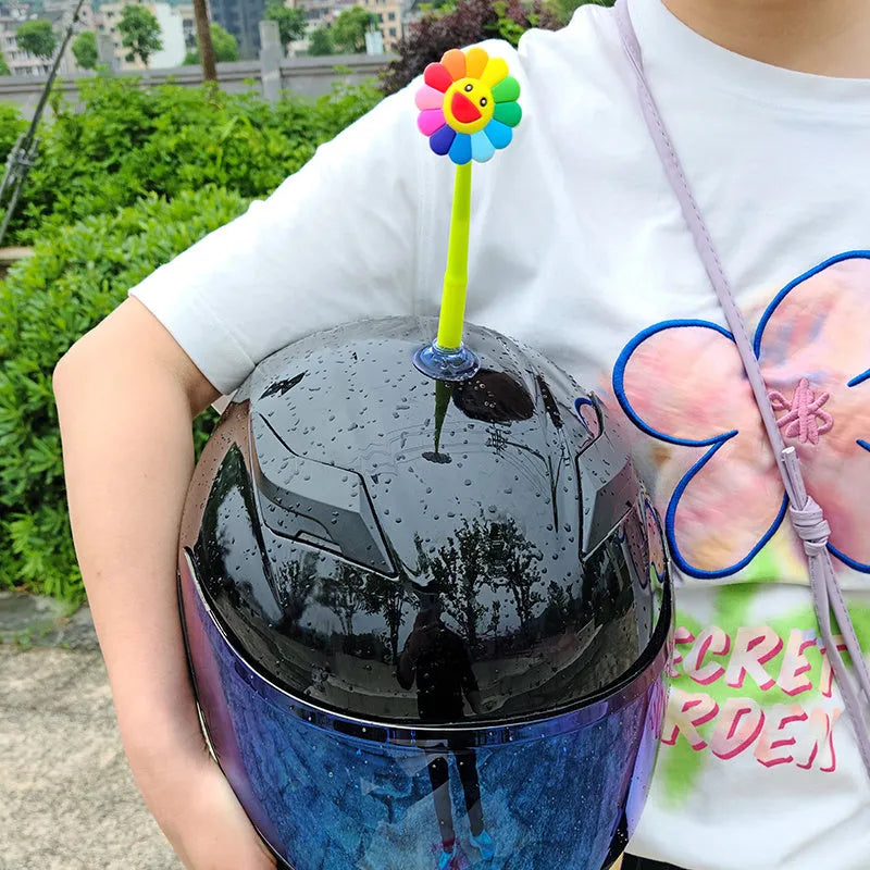 Swinging silicone sunflower decoration with suction cup for motorcycle or bicycle helmet.