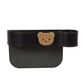 Leather car seat gap storage box with a cartoon bear design hanging next to a car seat.