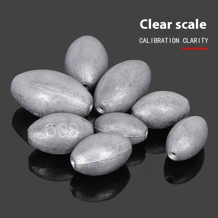 Rugby-shaped olive lead fishing sinker with scale texture pattern and plastic core construction
