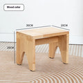 Solid wood shoe changing stool with distressed finish and bracket structure in a living room setting
