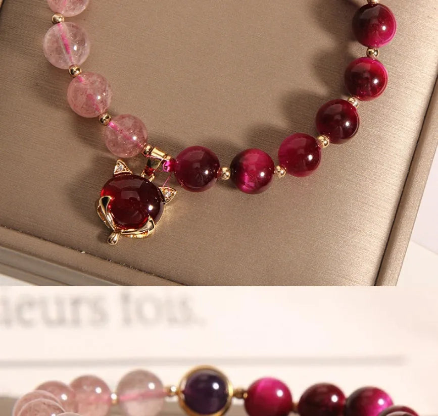Strawberry crystal bead bracelet on elastic rope measuring 18cm with simple design