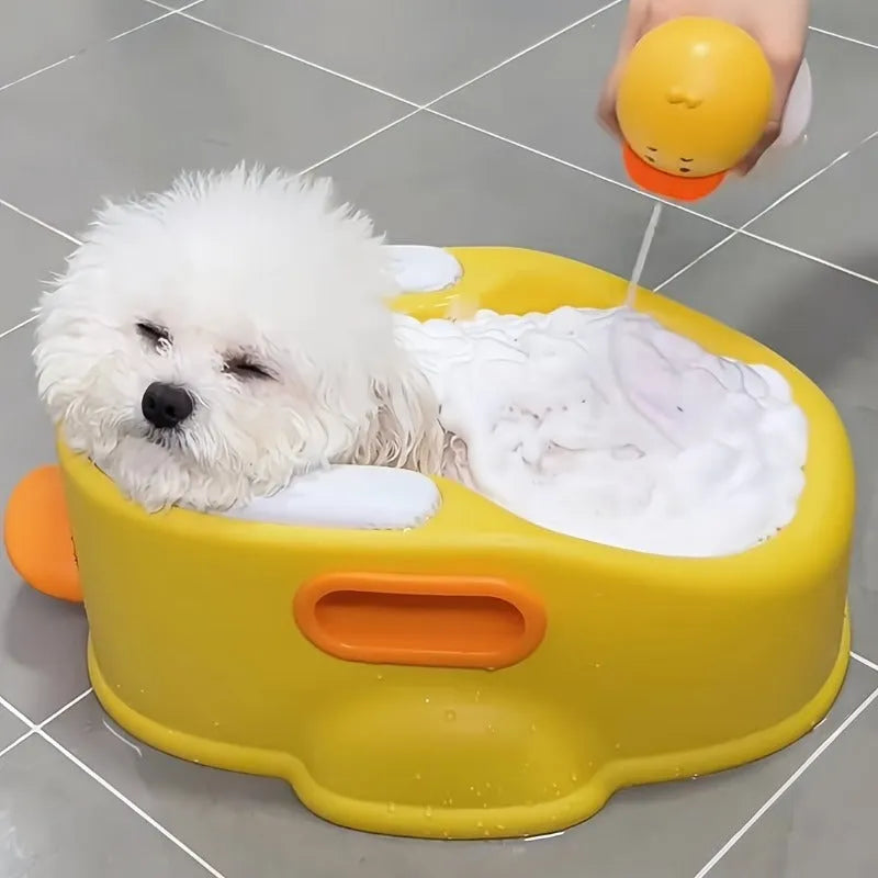 Blue PVC pet bath tub shaped like a duck for washing dogs and cats, shown on a bathroom floor.