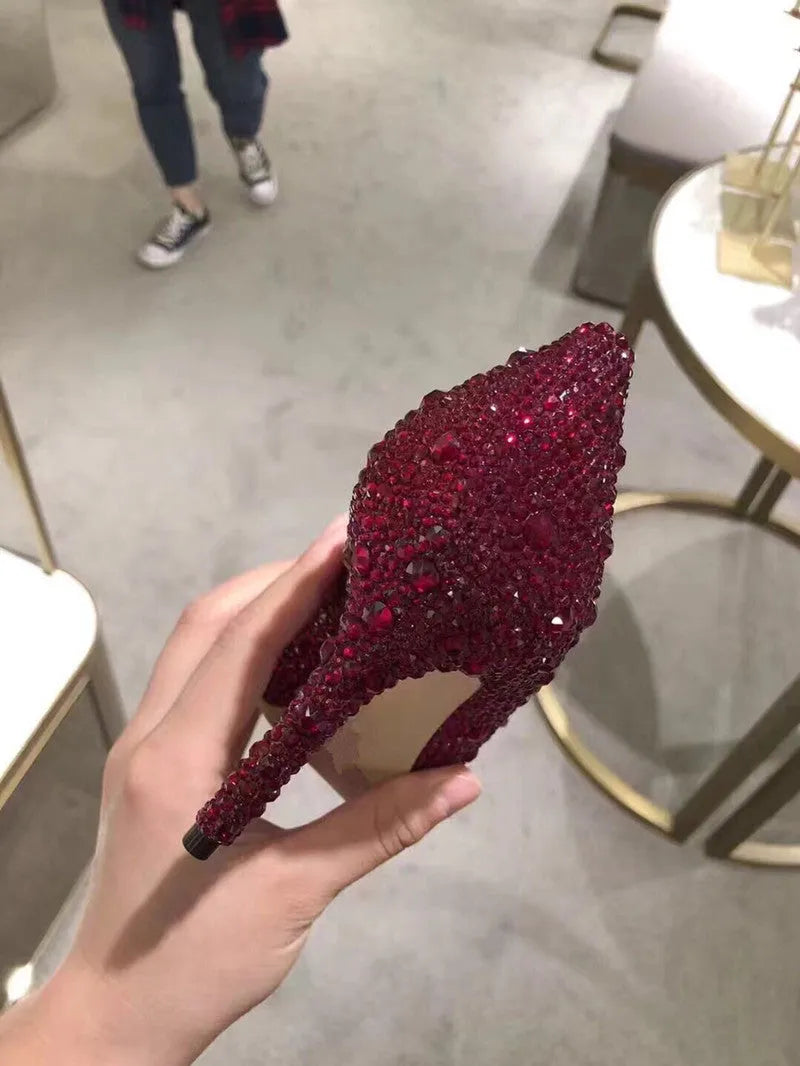 Women's gold pointed toe high heels with rhinestone decoration and stiletto heel