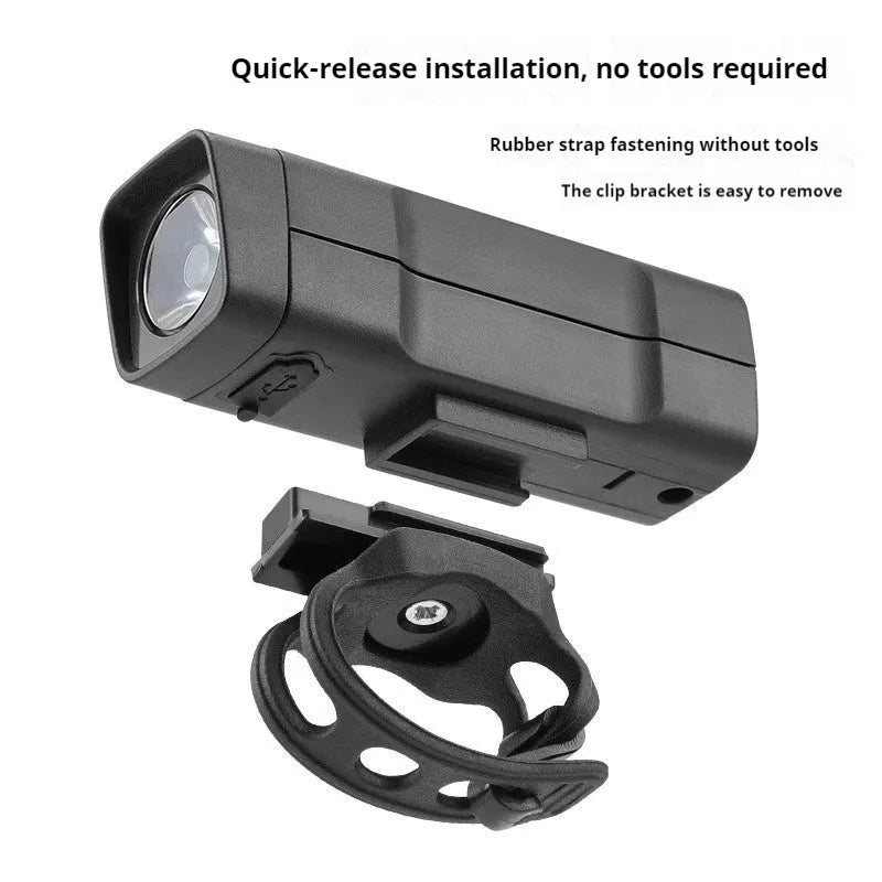 USB rechargeable bicycle headlight with quick-release strap bracket mounted on handlebars