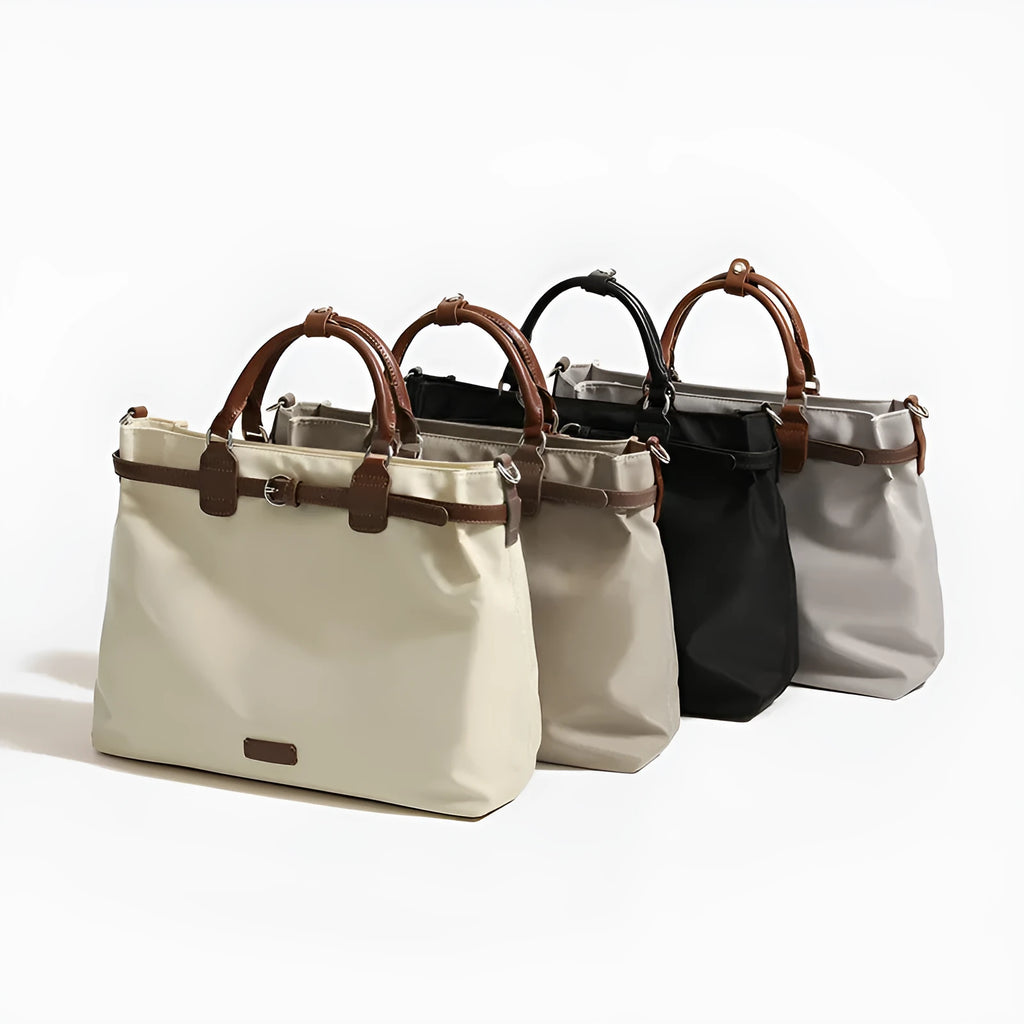 Women's nylon tote bag in creamy white with multiple internal pockets and three shoulder straps.