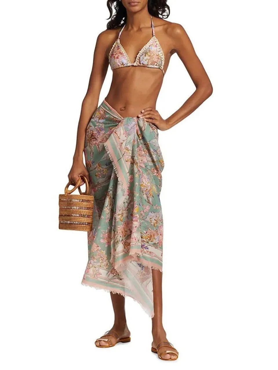 Women's creamy-white floral bikini set with removable skirt on size label