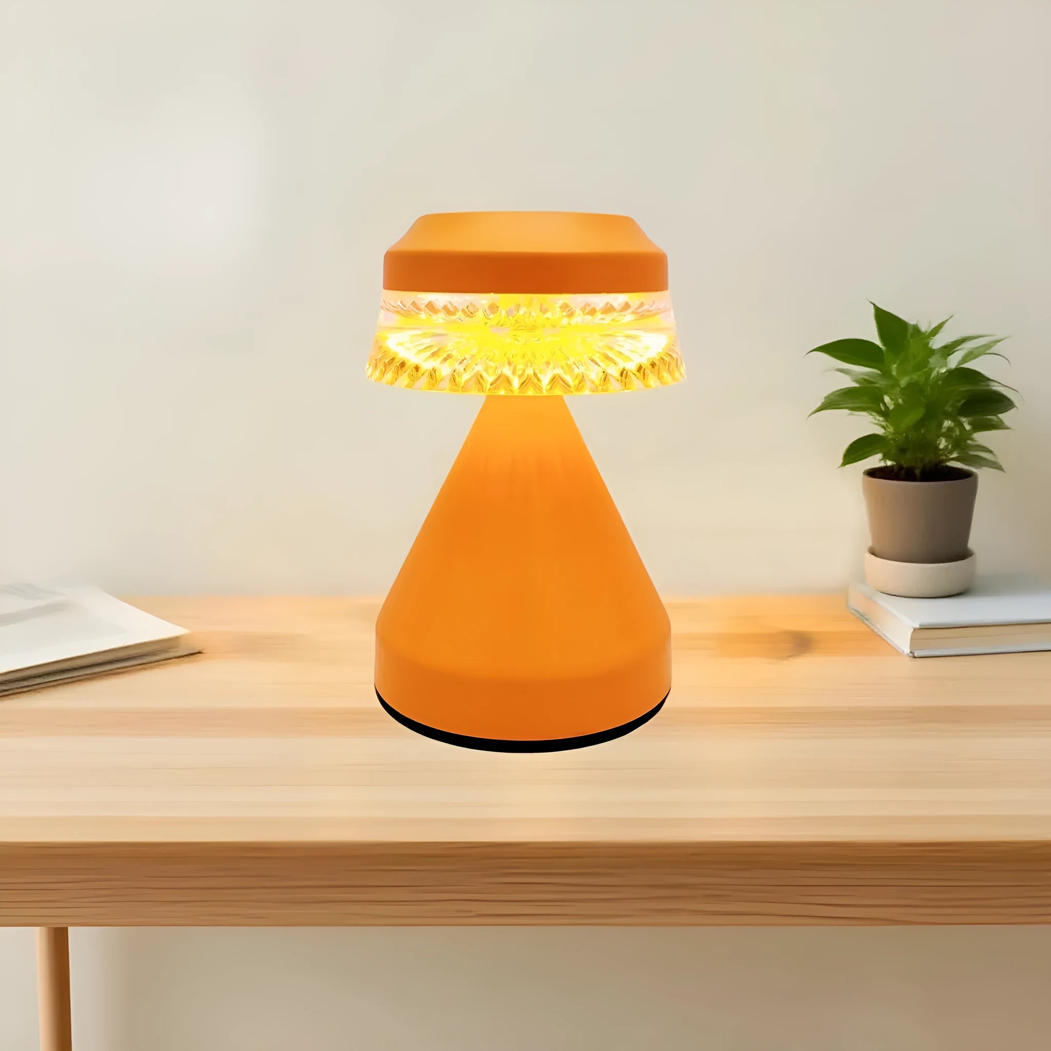 Black creative LED bedside night lamp with USB cable on a wooden table.