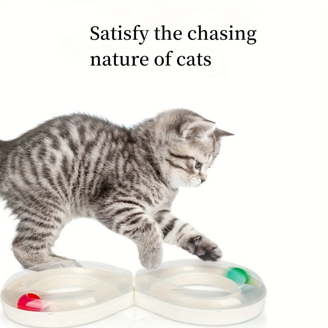 Blue and white plastic cat turntable track ball toy with a teasing stick on a flat surface.