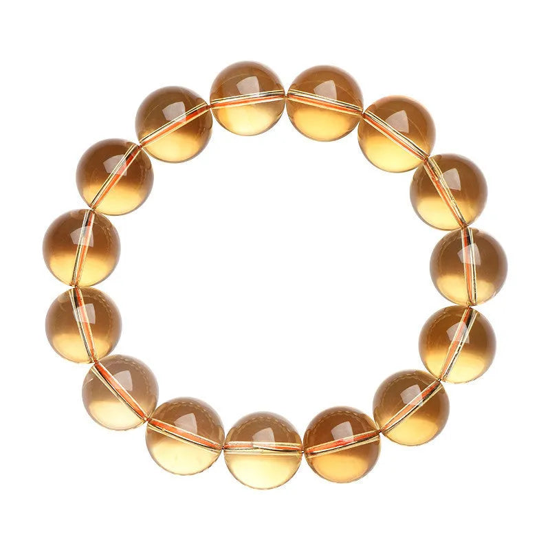 Natural citrine scattered beads bracelet showing polished gemstone beads on a cord.