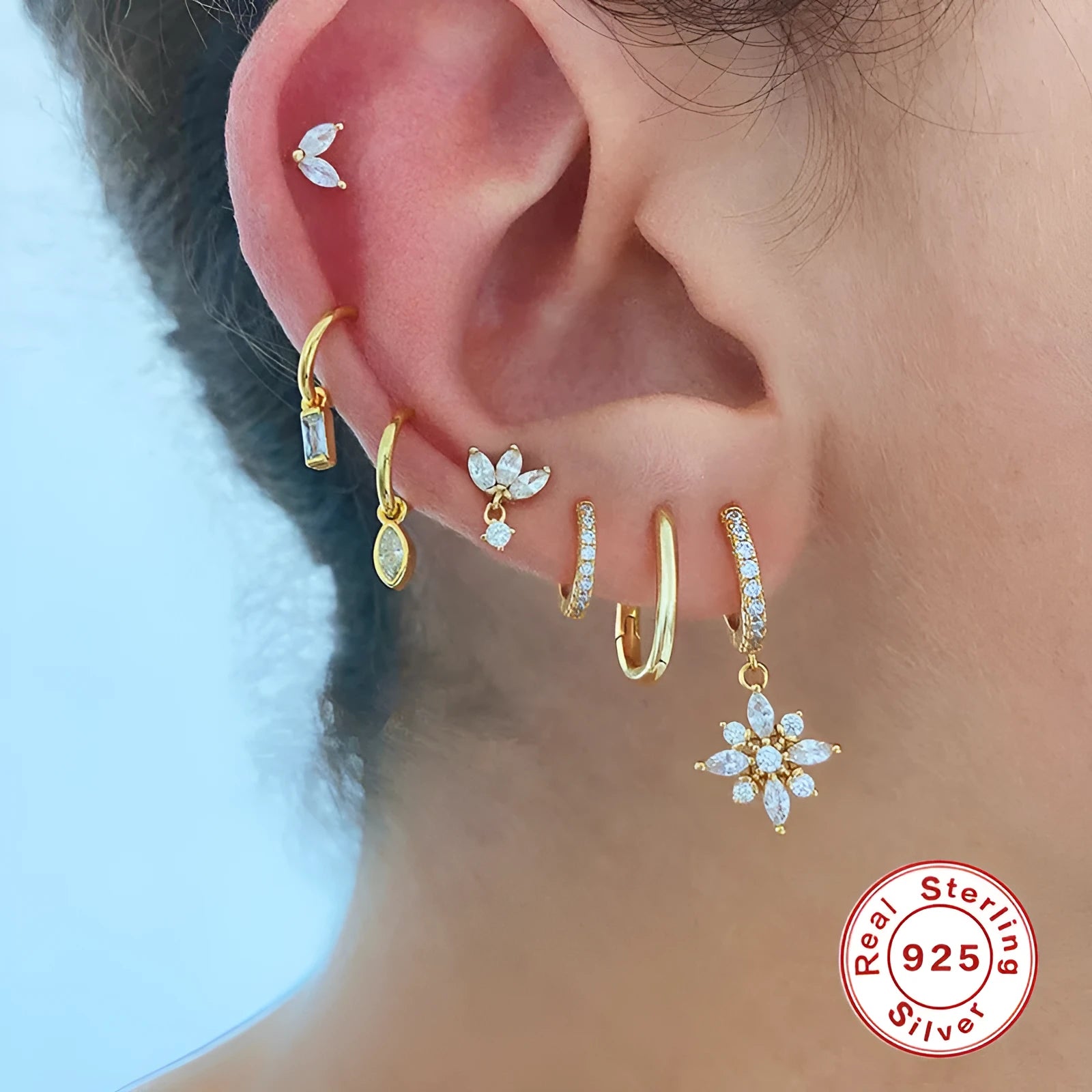A pair of women's S925 sterling silver snowflake pendant earrings with a geometric design, available in yellow gold or white gold colour finishes.