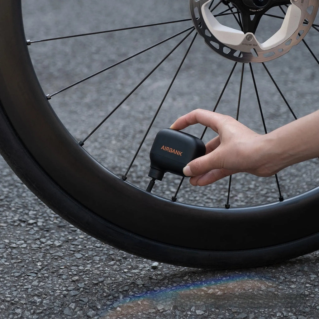 AS100 black electric bicycle pump with USB charging cable and waterproof bag