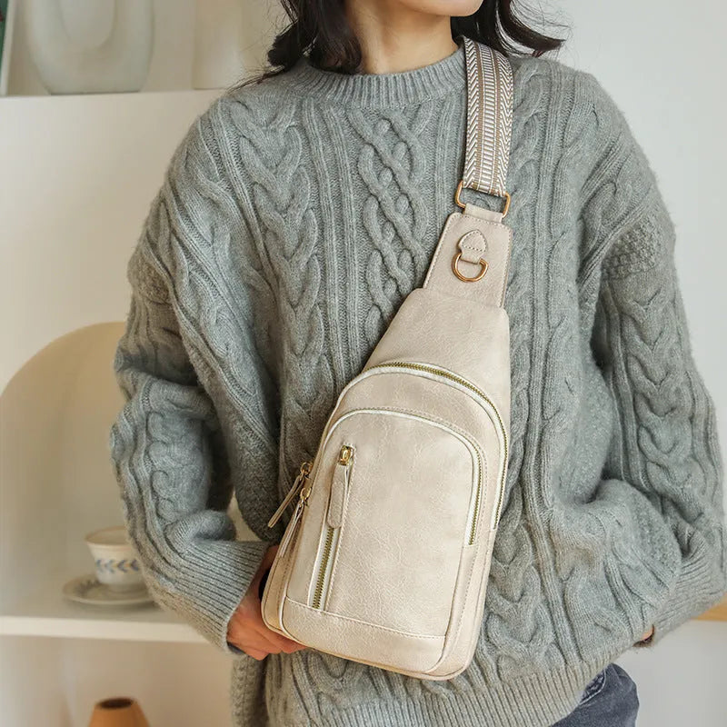 Women's soft PU chest crossbody bag showing open pocket and street style design