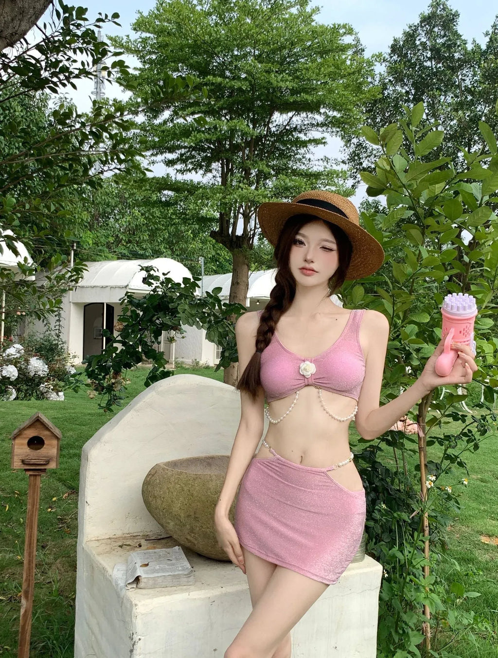 Women's three-piece bikini swimsuit set in pink and black colours with briefs style bottoms