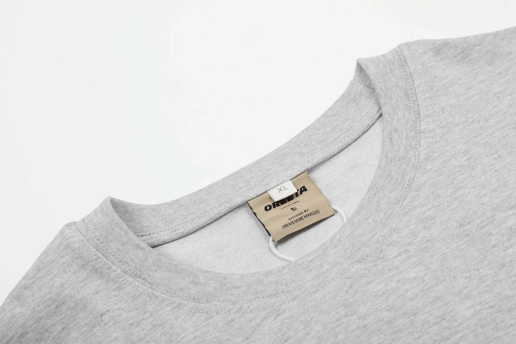 Men's black loose fit cotton long sleeve pullover on a hanger, casual retro style